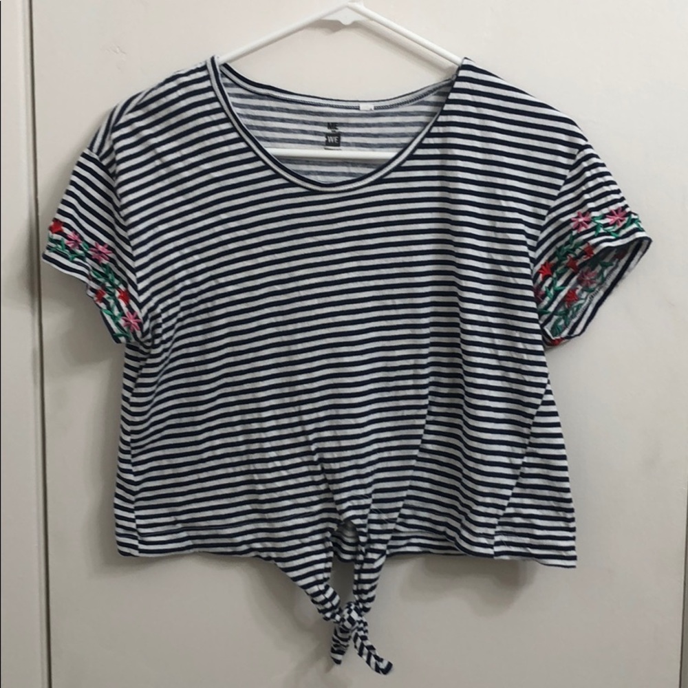 A nice blue and white shirt with flower designs
